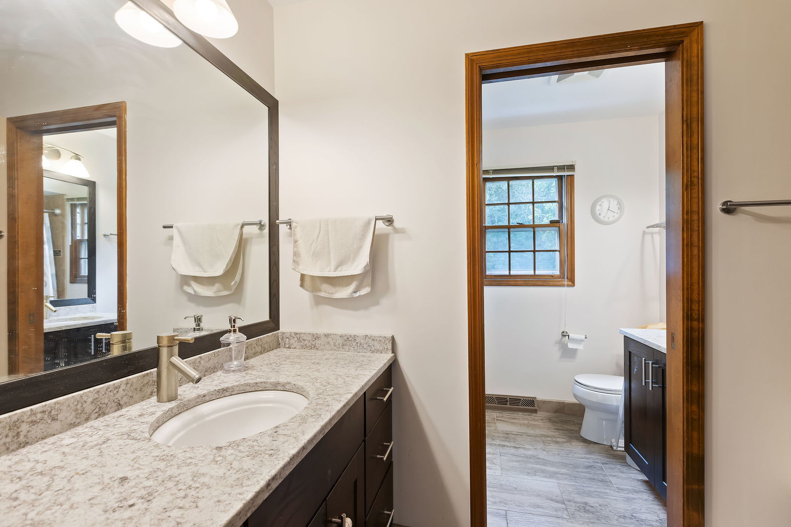 2647 Sun Valley Road Lisle, IL 60532 - Photo 19 of 26 a bathroom with a granite countertop sink a toilet and a mirror