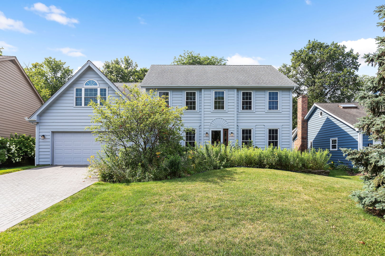 2647 Sun Valley Road Lisle, IL 60532 - Photo 2 of 26 a front view of a house with garden