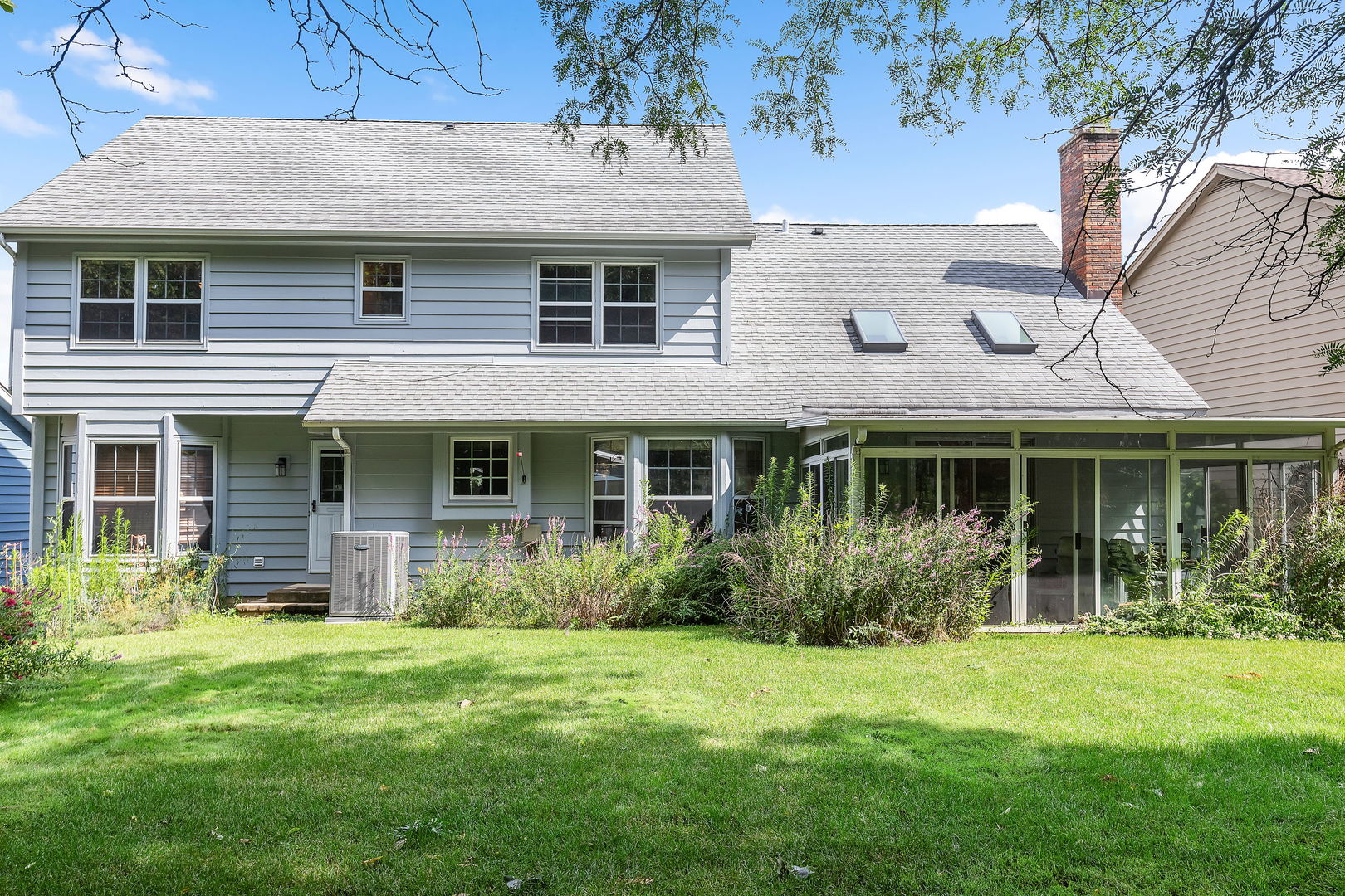 2647 Sun Valley Road Lisle, IL 60532 - Photo 21 of 26 a front view of a house with garden