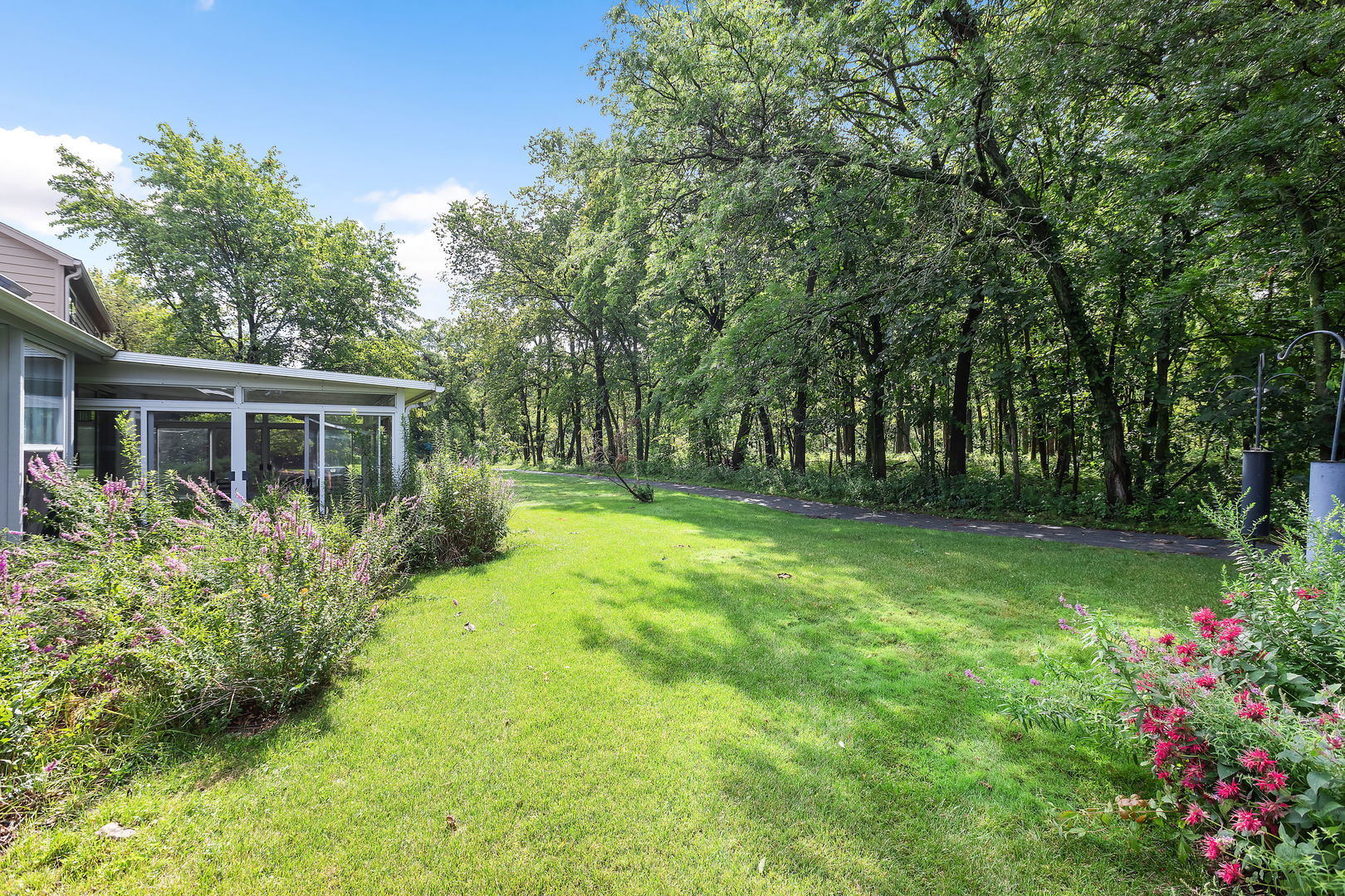 2647 Sun Valley Road Lisle, IL 60532 - Photo 22 of 26 a view of backyard with garden and trees