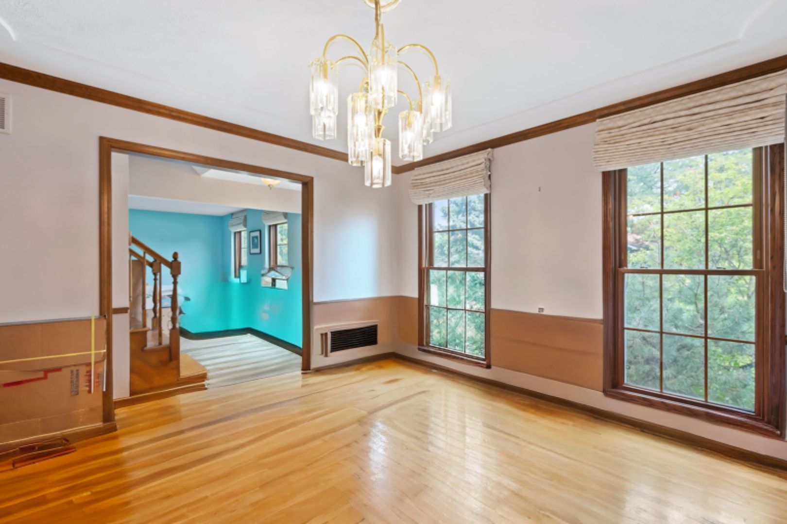 2647 Sun Valley Road Lisle, IL 60532 - Photo 5 of 26 a view of a livingroom with a chandelier fan and windows