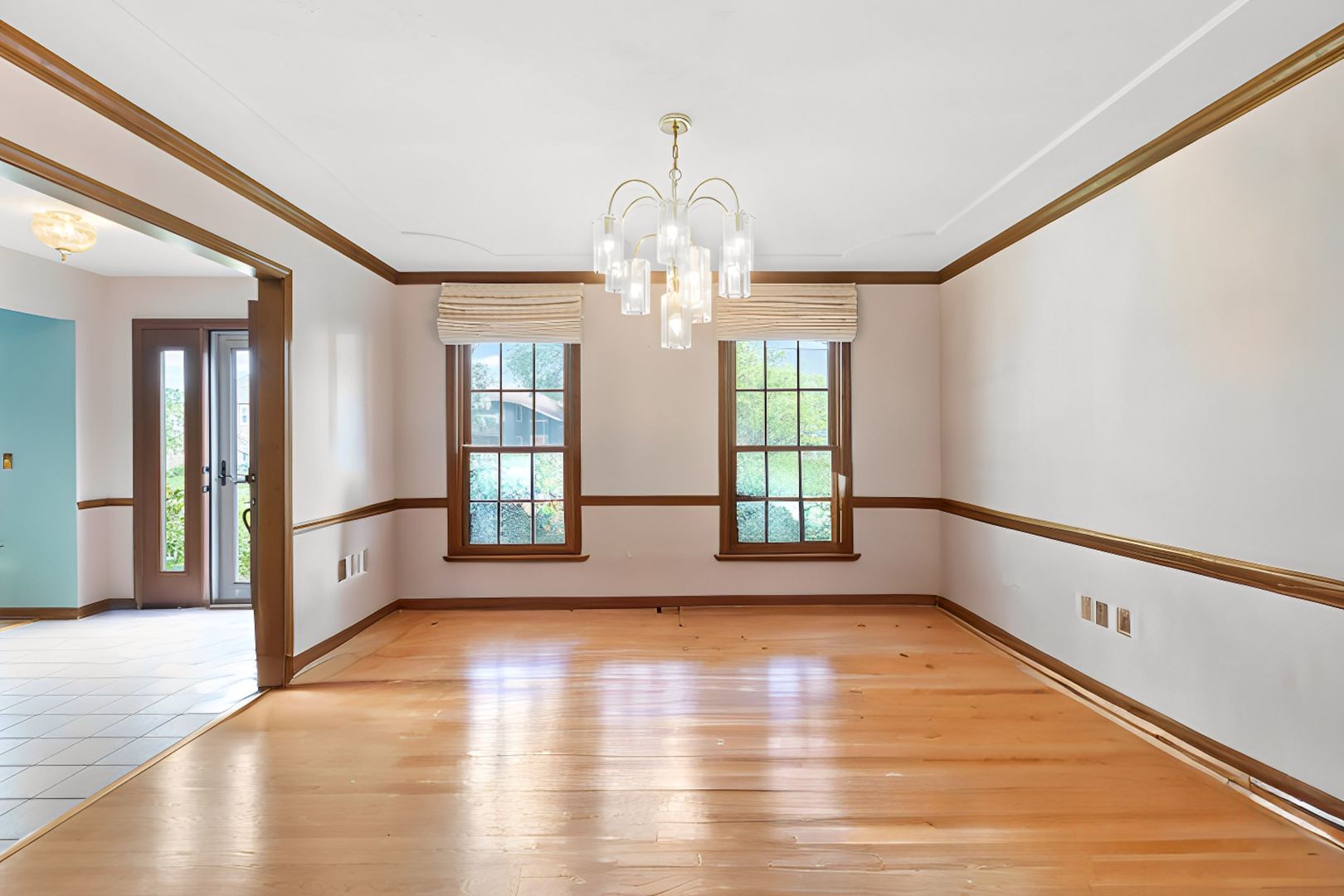 2647 Sun Valley Road Lisle, IL 60532 - Photo 6 of 26 a view of an empty room with wooden floor and a window