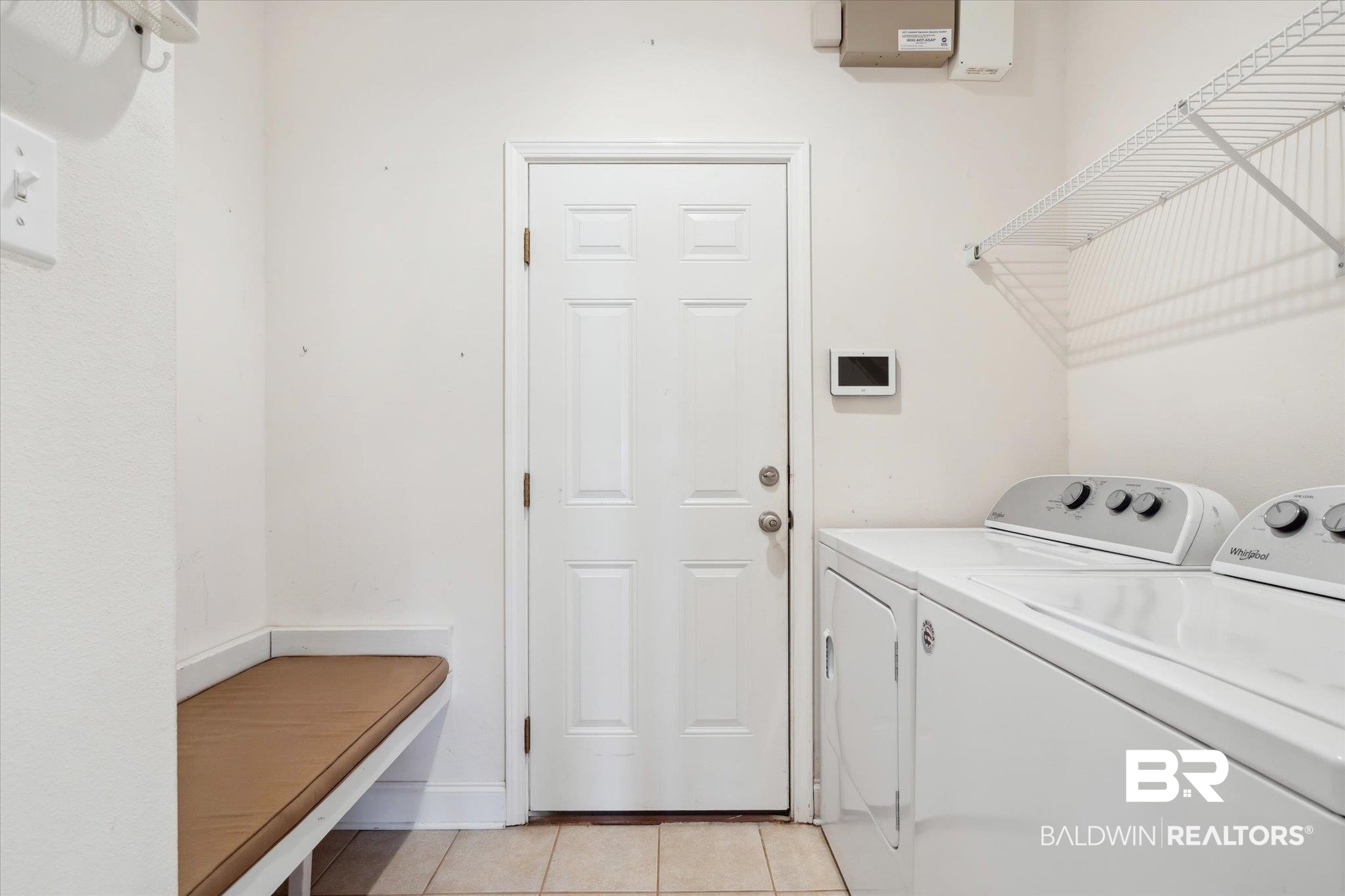 17297 Tallasee Boulevard Foley, AL 36535 - Photo 18 of 24 Laundry room with washer and clothes dryer and light tile patterned floors