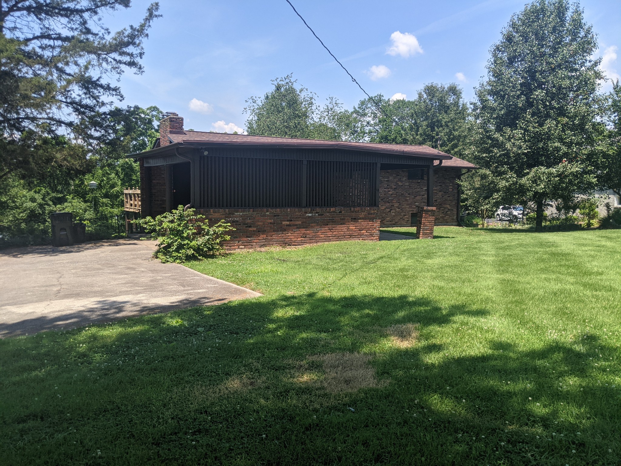 121 Lake Point Drive Gallatin, TN 37066 - Photo 5 of 5 a view of a house with a yard and a large tree