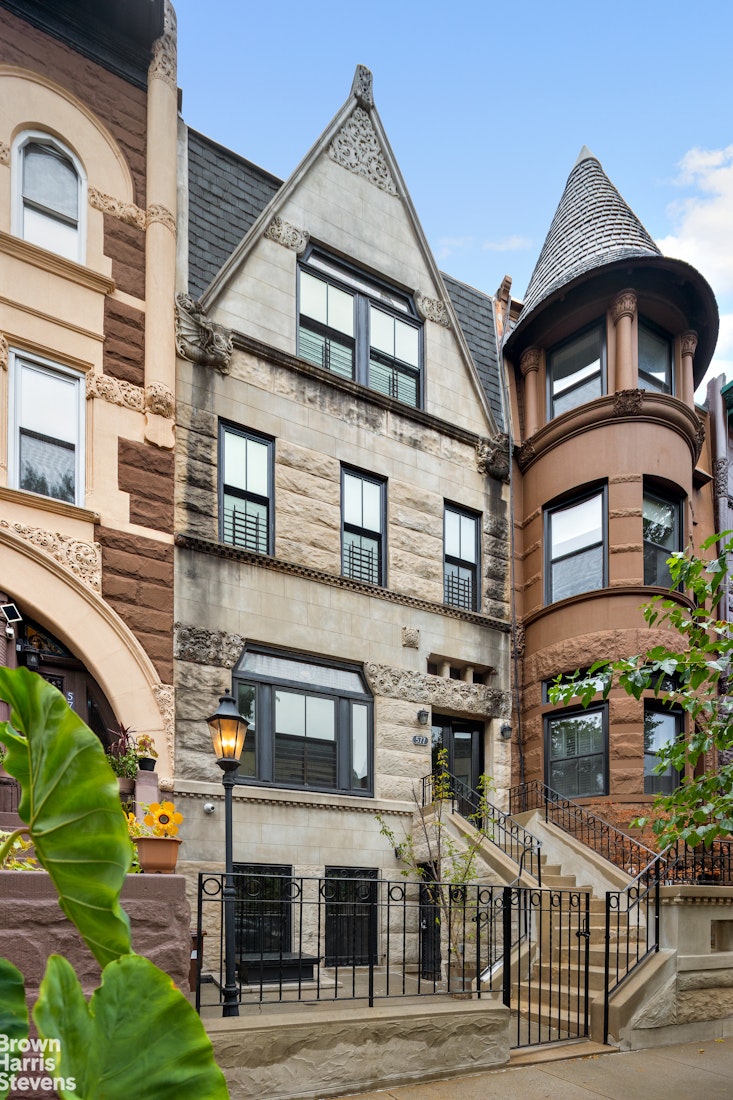 577 Jefferson Avenue Brooklyn, NY 11221 - Photo 15 of 16 a front view of a residential apartment building with a yard