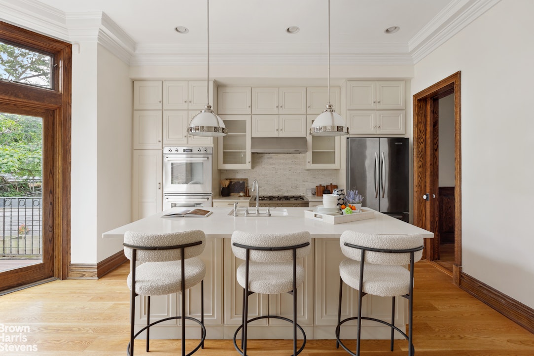 577 Jefferson Avenue Brooklyn, NY 11221 - Photo 6 of 16 a view of a dining room with furniture and wooden floor