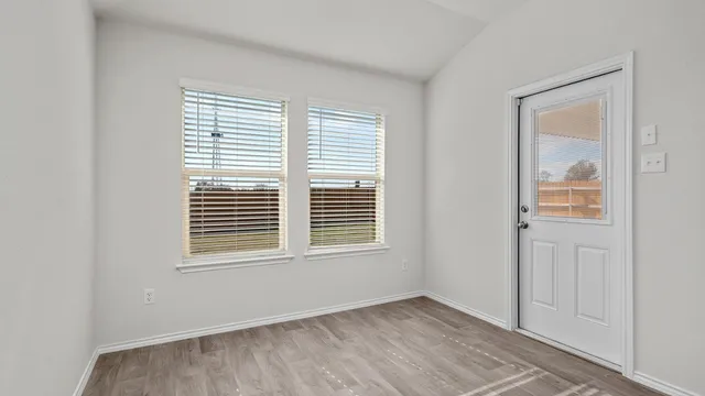 a kitchen with stainless steel appliances granite countertop a refrigerator stove top oven a sink and dishwasher