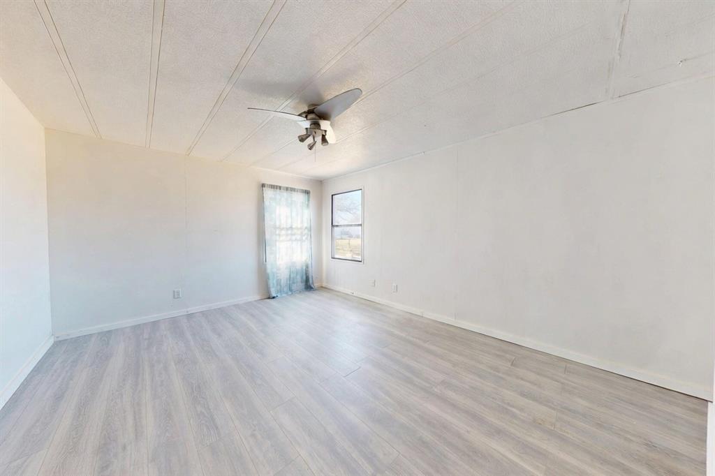 206 Creekview Meadows Court Springtown, TX 76082 - Photo 11 of 13 Grey House Bedroom