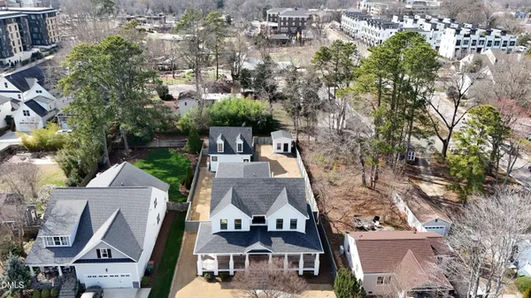 an aerial view of a house with a yard