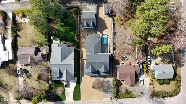 an aerial view of residential houses with outdoor space