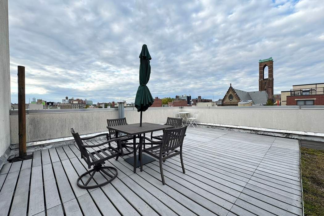 51 East 128th Street, Unit 6A Manhattan, NY 10035 - Photo 14 of 14 a view of a terrace with seating space