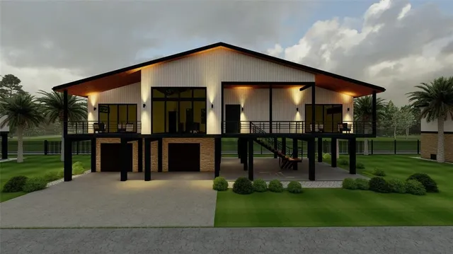 a view of a house with a yard and sitting area