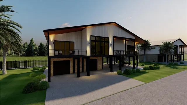 an aerial view of a house with a yard swimming pool and outdoor seating