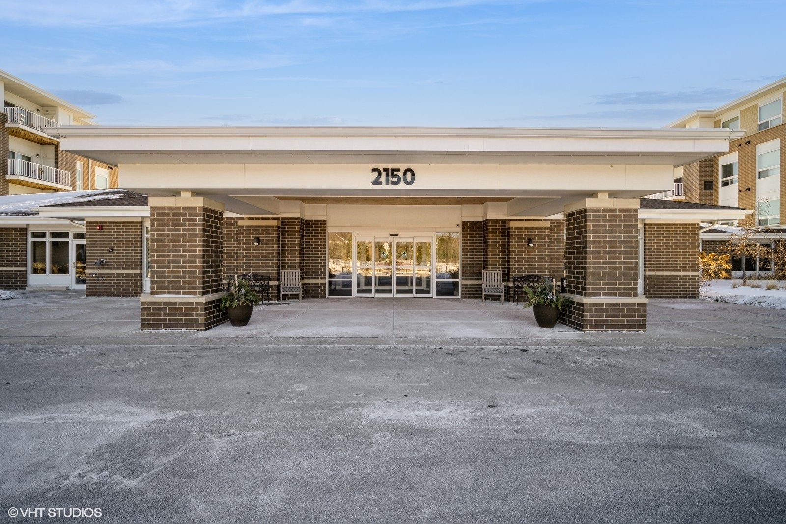 a view of a building with sitting area