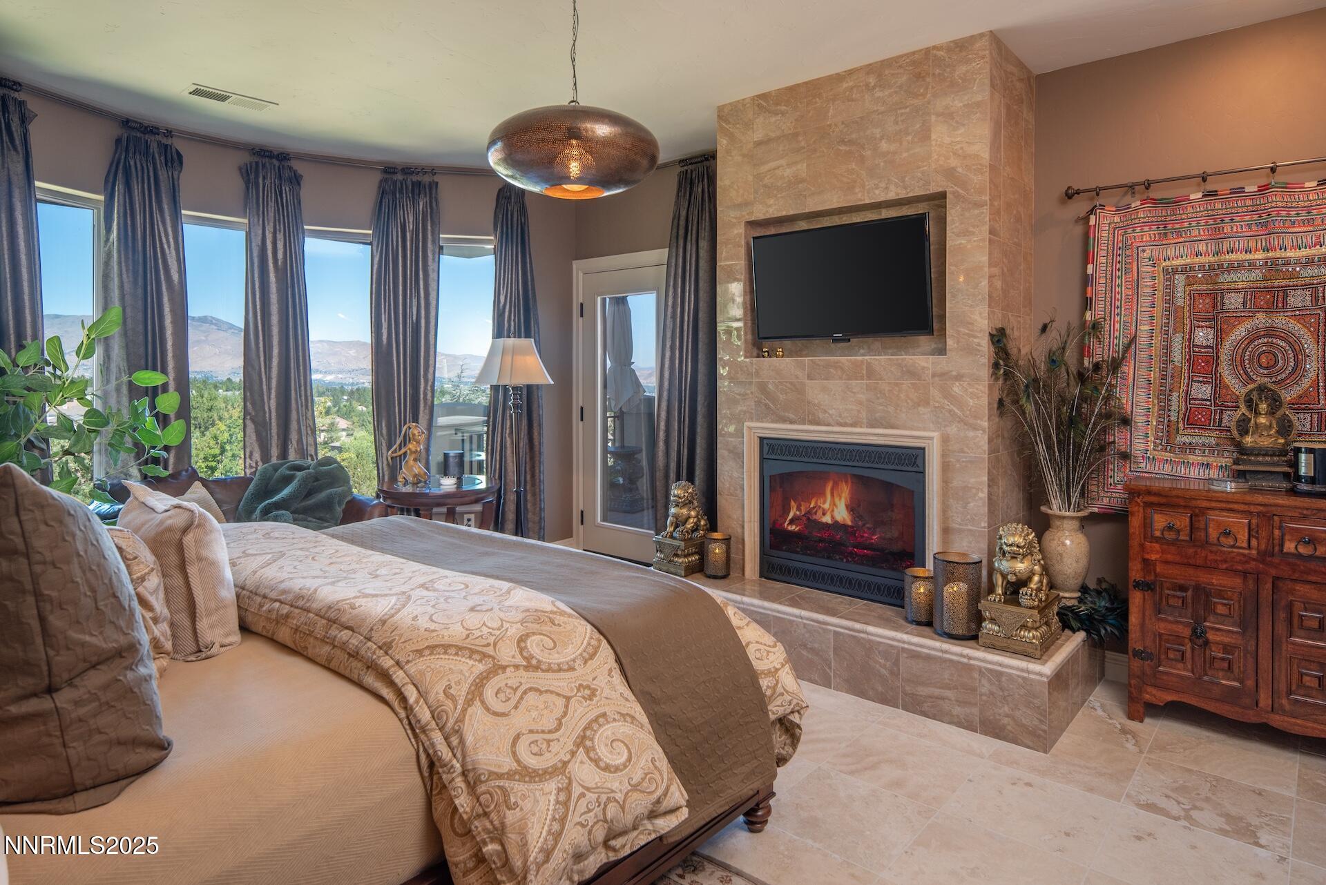 4905 Mountainshyre Road Reno, NV 89519 - Photo 18 of 64 a bed room with a bed and a fireplace