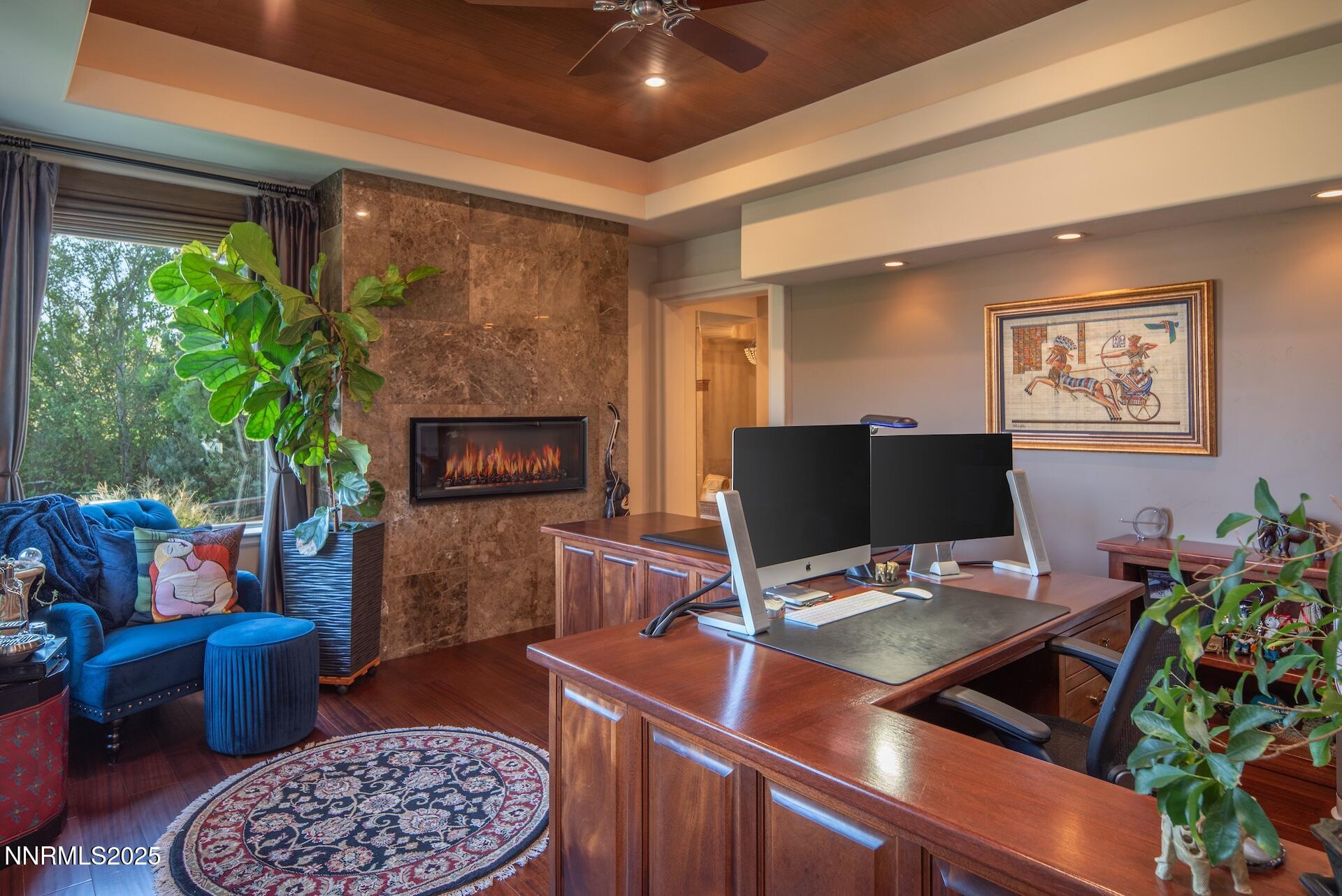 4905 Mountainshyre Road Reno, NV 89519 - Photo 25 of 64 a work room with furniture a rug and a fireplace