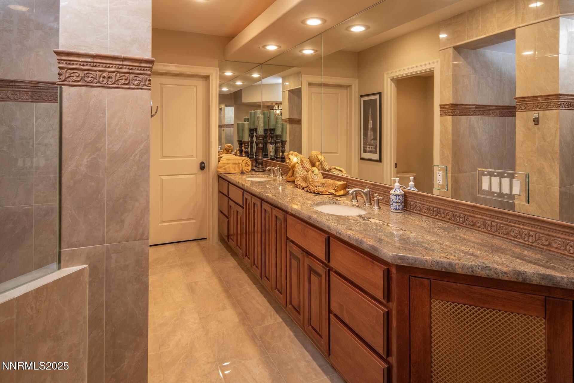 4905 Mountainshyre Road Reno, NV 89519 - Photo 31 of 65 a bathroom with a granite countertop sink mirror and double