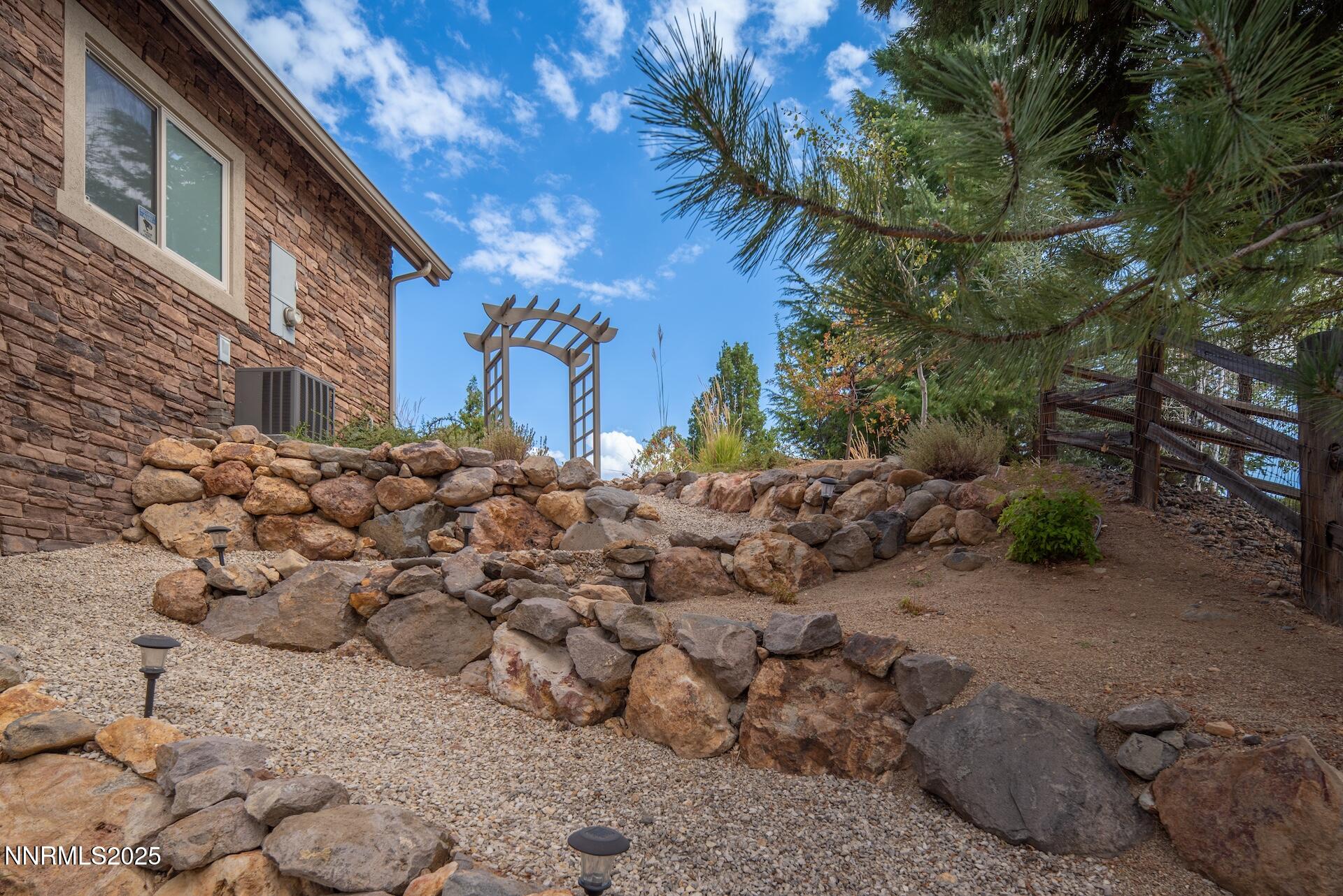 4905 Mountainshyre Road Reno, NV 89519 - Photo 56 of 65 a view of a yard with a large tree