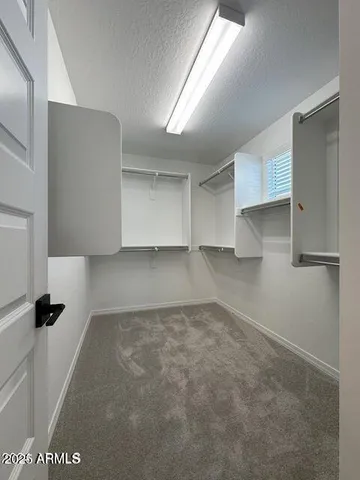 wooden floor in an empty room and a window