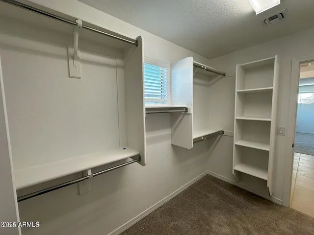 a view of an empty walk in closet