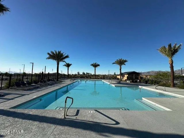 a view of a street with a cars parked on the road