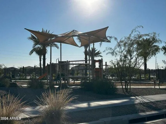 a view of a street with cars parked