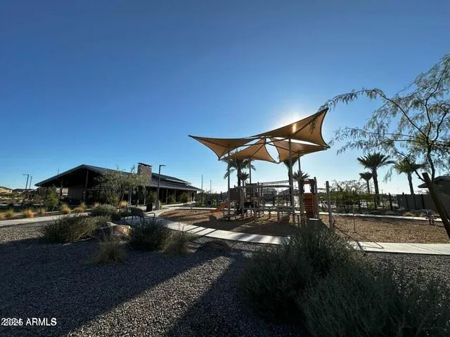 a view of a pathway of a house and a yard