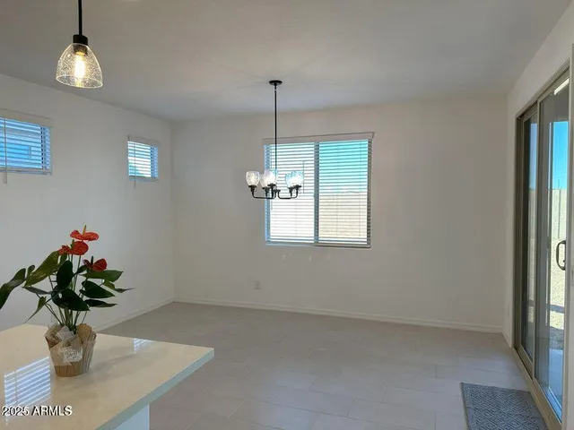 a vase of flowers sitting on a table in a room