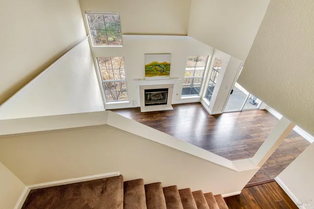 a view of an entryway with wooden floor