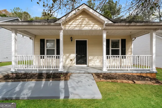 front view of a house with a yard