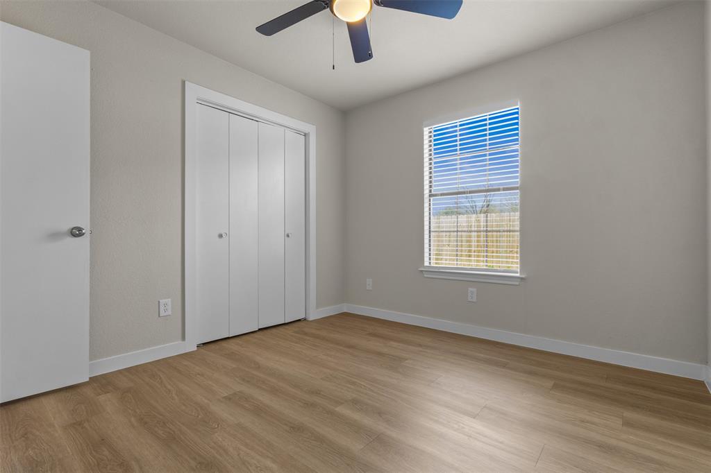 701 Rosehill Road Terrell, TX 75160 - Photo 12 of 20 wooden floor in an empty room with a window
