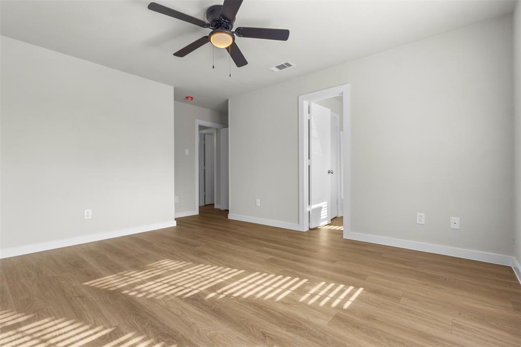 701 Rosehill Road Terrell, TX 75160 - Photo 10 of 20 a view of empty room with wooden floor and fan