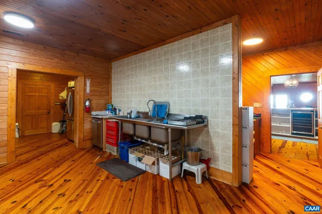 a bathroom with a sink a mirror and a shower