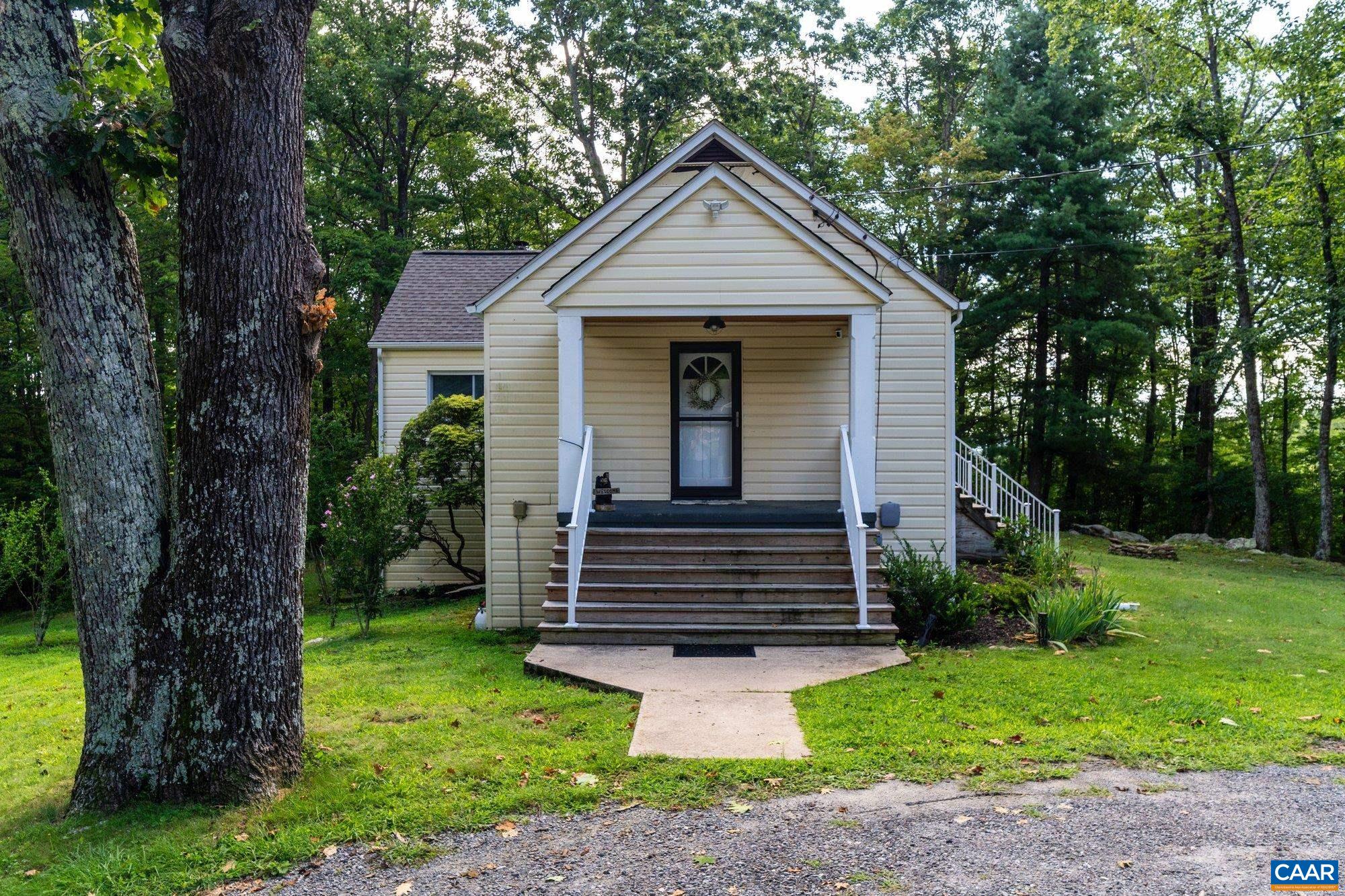 1376 Wyatt Mountain Road Dyke, VA 22935 - Photo 66 of 75 a front view of a house with a garden