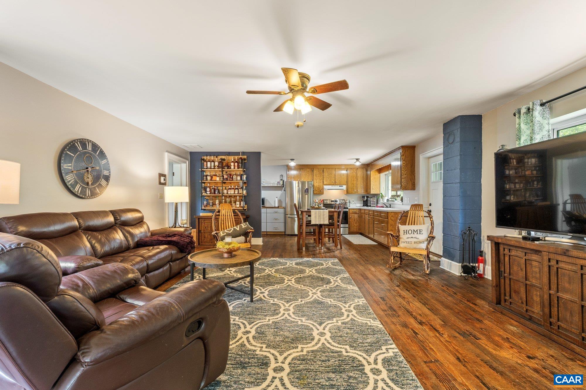 1376 Wyatt Mountain Road Dyke, VA 22935 - Photo 68 of 75 a living room with furniture a flat screen tv and a clock