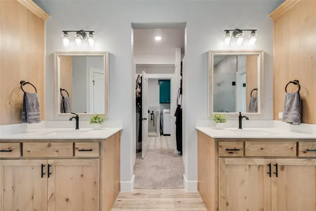 a bathroom with a sink vanity and a mirror
