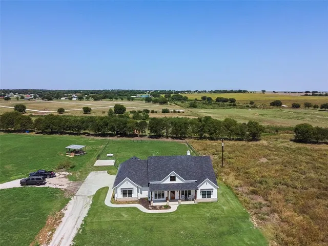 a view of a lake with a yard