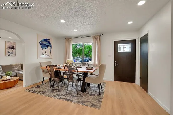 a view of a dining room with furniture window and outside view