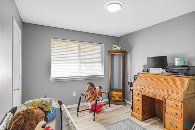 a room with furniture and a window