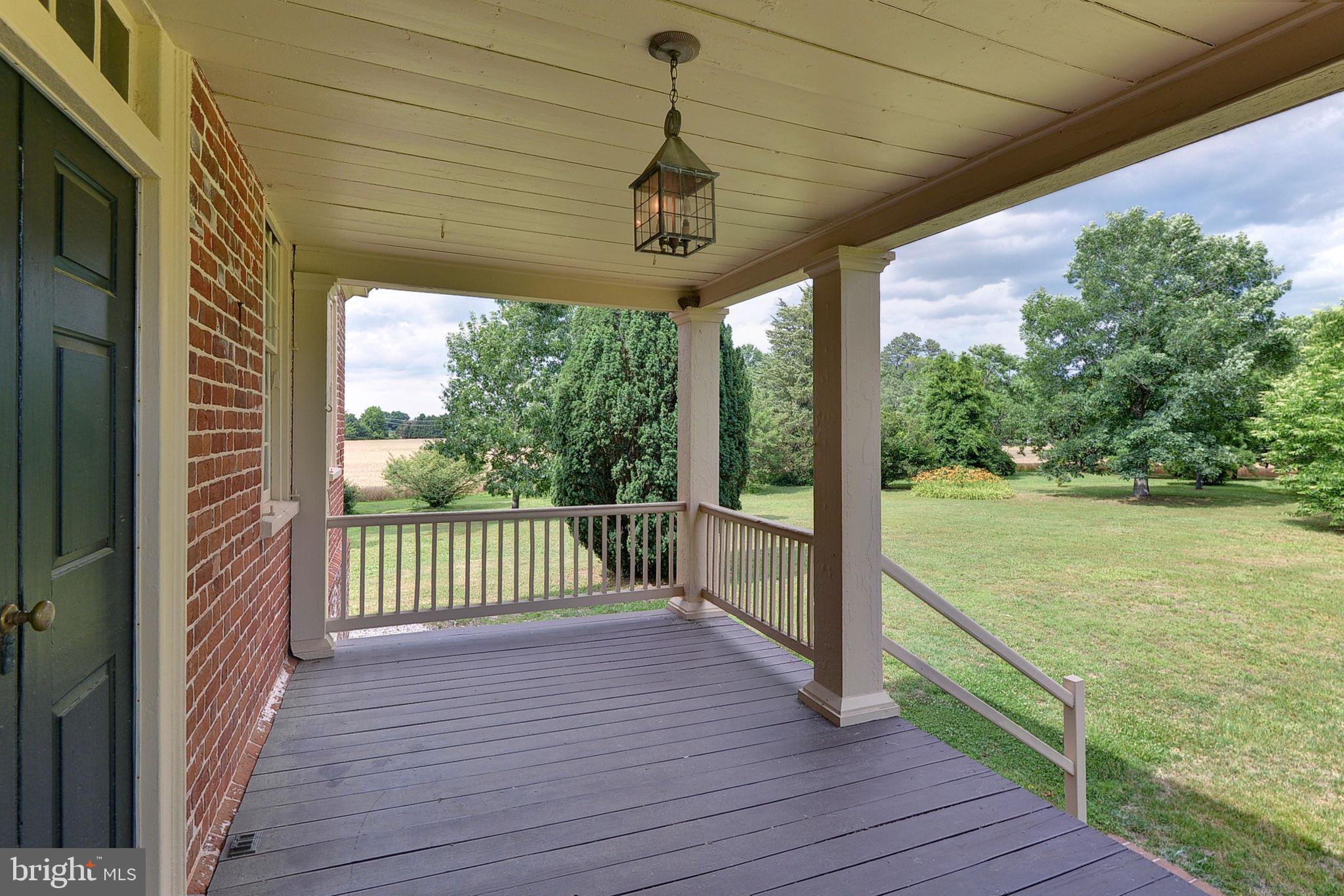 2459 Dunbrooke Road Tappahannock, VA 22560 - Photo 13 of 85 a view of a deck with wooden floor next to a yard