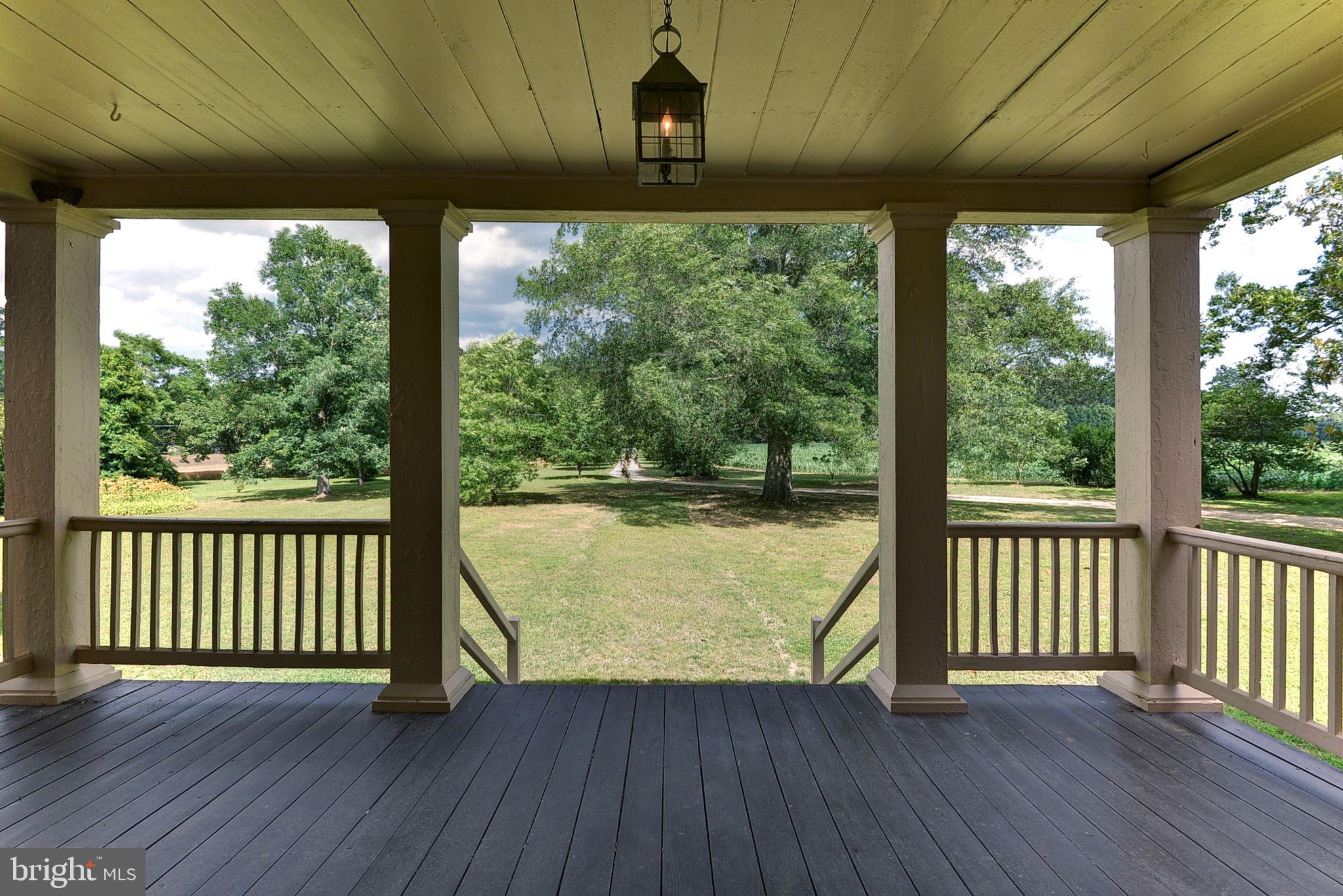 2459 Dunbrooke Road Tappahannock, VA 22560 - Photo 14 of 85 a view of a porch with wooden floor in front of a house