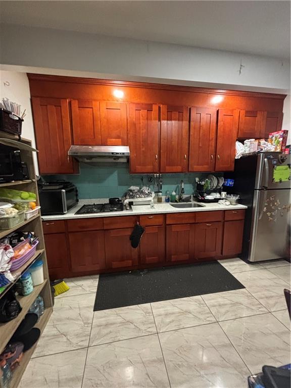 561 83rd Street Brooklyn, NY 11209 - Photo 2 of 6 a room with stainless steel appliances kitchen island granite countertop a table and chairs in it