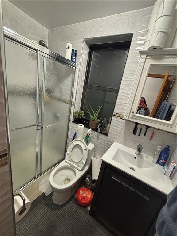 561 83rd Street Brooklyn, NY 11209 - Photo 6 of 6 a bathroom with a sink toilet and shower