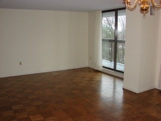 40 Village Road, Unit 610 Middleton, MA 01949 - Photo 16 of 36 an empty room with wooden floor and windows