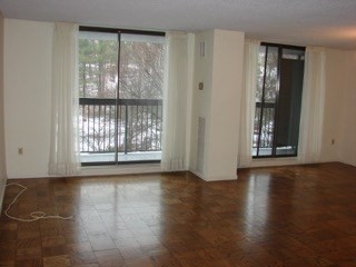 40 Village Road, Unit 610 Middleton, MA 01949 - Photo 19 of 36 a view of an empty room with wooden floor and a window