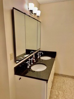 40 Village Road, Unit 610 Middleton, MA 01949 - Photo 24 of 36 a bathroom with a sink and a mirror