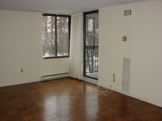 40 Village Road, Unit 610 Middleton, MA 01949 - Photo 26 of 36 a view of an empty room with wooden floor and a window