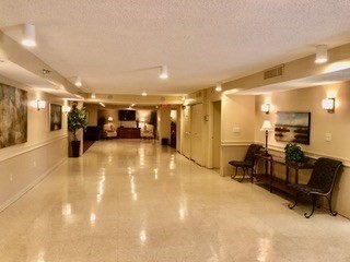 40 Village Road, Unit 610 Middleton, MA 01949 - Photo 30 of 36 a lobby with furniture and a mirror