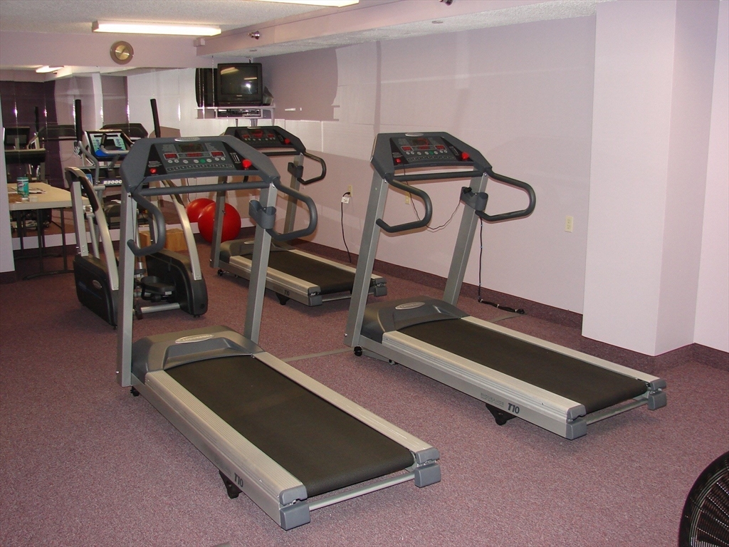 40 Village Road, Unit 610 Middleton, MA 01949 - Photo 33 of 36 a view of a room with gym equipment