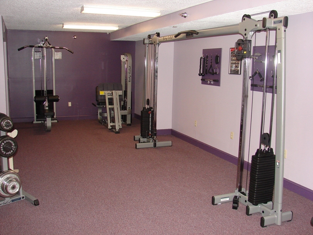 40 Village Road, Unit 610 Middleton, MA 01949 - Photo 34 of 36 a view of a room with gym equipment